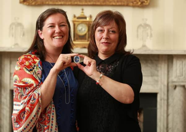 Emma Burns and Bronagh Masoliver celebrate earning Blue Badge Tourist Guide status.