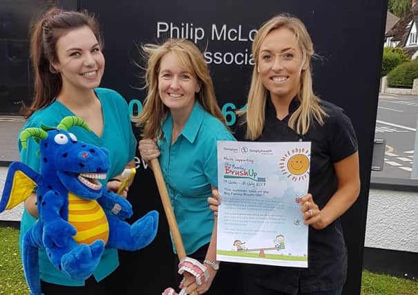 Pictured promoting the Big Family Brush Up initiative are Dunmurry Dental Practice staff Fiona Kelly, dental nurse; Debbie McLorinan, manager; and Nicola Quinn, dentist.