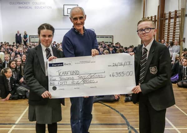 Gareth, a representative from Tear Fund, attended a special assembly when pupils handed over a cheque for Â£4355 raised from both events. Cullybackey College have raised enough money to provide food parcels to 435 families which is enough to feed them for one month.