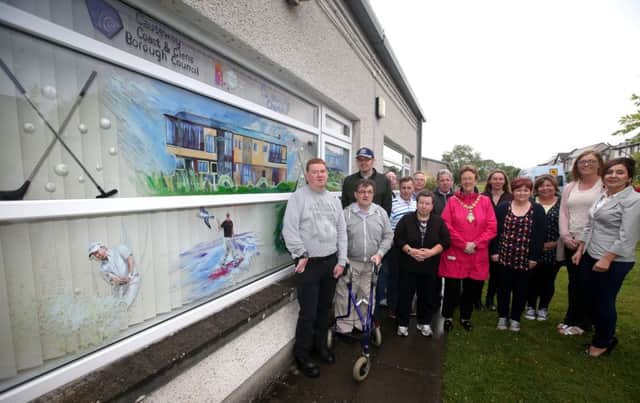 Staff and members from Glenshane Care Association in Dungiven show of their winning window display to the Mayor of Causeway Coast and Glens Borough Council Councillor Joan Baird OBE and Annette Deighan from Causeway Chamber of Commerce (second right).