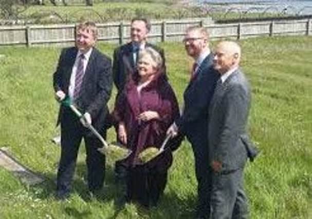 Sod cutting on the site of the new Greenisland House.
