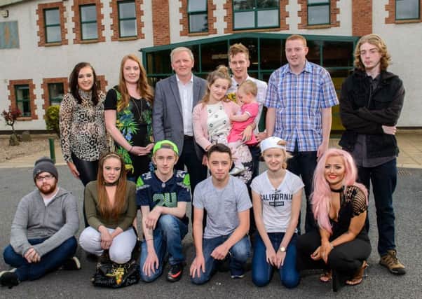 Young people from the Game Changer Programme in Glabally celebrate their success with Bridget Nugent programme leader (second from left) and Allen McAdam, International Fund for Ireland Board Memeber (third from left).