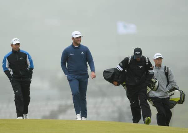 Pablo Larrazabal of Spain, second from left, and Jon Rahm of Spain, centre, during a practice round ahead of the Dubai Duty Free Irish Open Golf Championship at Portstewart