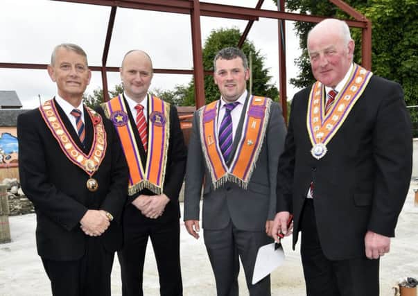 Edward Stevenson, Grand Master of the Grand Orange Lodge of Ireland, laying the foundation stone of the new hall for Newtowncunningham True Blues L.O.L. 1063. Included are, from left, Alderman Maurice Devenney, City Grand Master, City of Londonderry Grand Orange Lodge, Don Pearson, District Master, East Donegal District No.3, and Graeme Parke, WM, Newtowncunningham L.O.L. 1063.