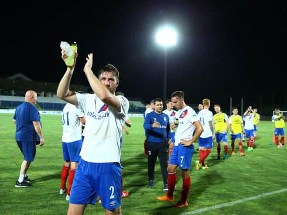 Linfield players applaud the travelling support after their victory over La Fiorita Montegiardino at the San Marino Stadium.