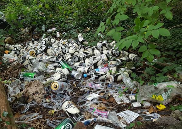 Hundreds of beer cans, drugs paraphernalia and empty alcohol bottles piled up in alley near Trasna Way, Lurgan