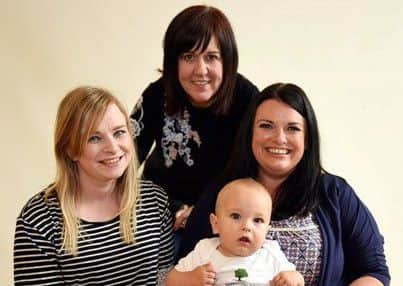 Participants in the Roots of Empathy programme at Sunnylands Primary School - Debbie McKeown and Harrison pictured with Caroline Peden (back) and Laura McConkey.