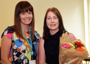 Selena Ramsey, Instructor, Northern Trust, presents a certificate to Norma Johnston from Moyle Primary School for five years commitment to the Roots of Empathy Programme