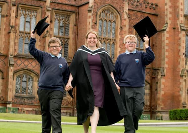 Pictured celebrating graduation success is Julie McVeigh with two of her sons, Peter and Aaron, who is graduating with a degree in Law, from the School of Law at Queen's University Belfast.