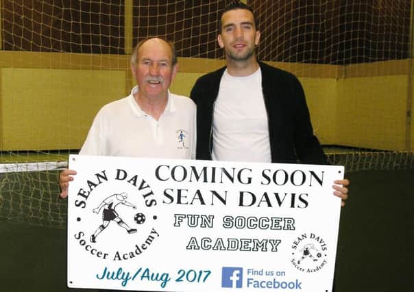 Sean Davis pictured with Republic of Ireland and Brighton defender Shane Duffy at the launch of this year's Fun Soccer Academy.