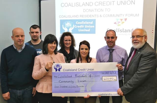 Receiving the cheque from Eimear McAlynn Marketing Officer and Brian ONeill Manager of Coalisland Credit  Union are Marion Dorman Chair and Francis Molloy MP Trustee of Coalisland Residents and Community Forum, Damien ONeill of Cairde UÃ­ NÃ©ill, volunteer Thomas Fox and Juda Sharkey facilities and project service user.