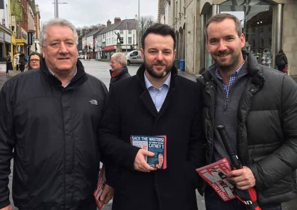 SDLP MLA Pat Catney with party leader Colum Eastwood and Gerard Catney, right.