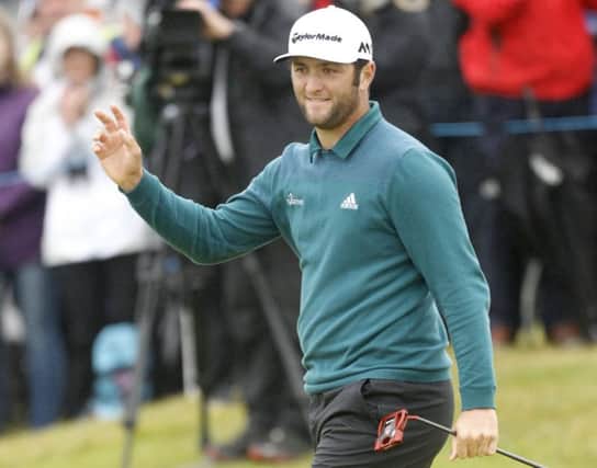 Jon Rahm waves to the crowd after making a putt on the 14th during round 2 of the Dubai Duty Free Irish Open golf championship at Portstewart Golf Club.  Picture by Peter Morrison/Presseye.com