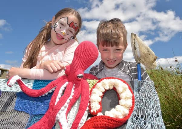 Having a great time at the Diamond Jubilee Wood, Whitehead which was transformed into a Woollen Wonderland. Hundreds of woolly creations, made by schools, knitting groups and individuals all over the country, were  installed in the wood and celebrated with a big family fun day on site.