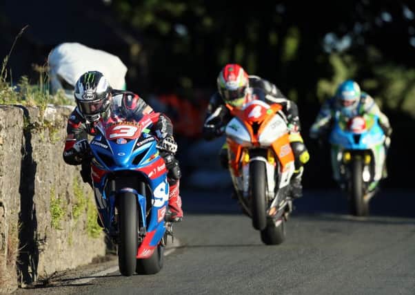 Michael Dunlop (Bennett's Suzuki) at Joey's Gate, named after the Ballymoney man's late uncle,leads Dan Kneen (DTR BMW) and Dean Harrison (Silicone Kawasaki) on his way to victory in the Corlett's 600-1000cc race at the Southern 100