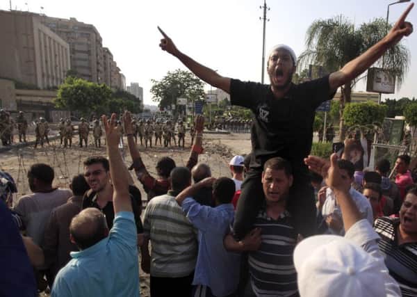 Muslim Brotherhood supporters protesting in Egypt in 2013, following the ousting of Mohammed Morsi by General Abdel Fattah el-Sisi.