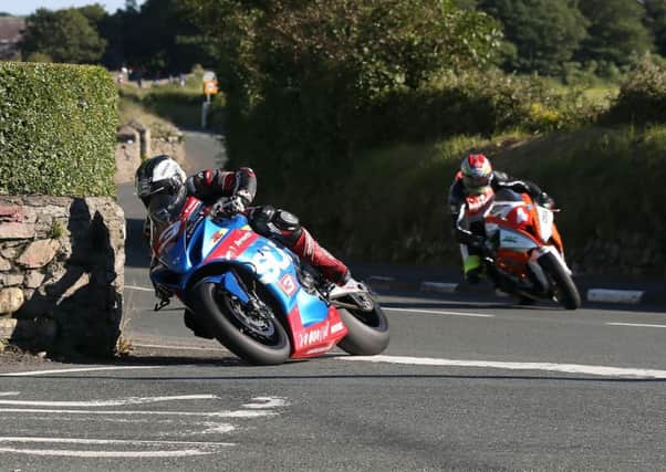 Michael Dunlop (Bennett's Suzuki) leads Dan Kneen (DTR BMW) around Ballabeg on his way to victory in the Senior race at the Southern 100