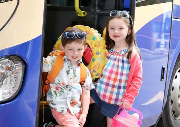 Sophia Clarke and brother, Finn Clarke are ready for summer. Translink has announced a number of seasonal fares for July and August. Picture by Darren Kidd /Press Eye.