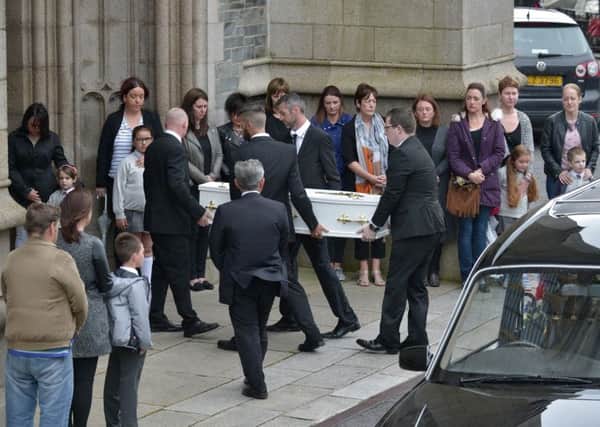 The small white coffin of six-year-old Donnacadh â¬ÜDonnyâ¬" Maguire is carried into St Eugeneâ¬"s Cathedral for Requiem Mass on Saturday morning. The St Eugeneâ¬"s Primary School pupil died following a tragic accident on Tryconnell Street on Tuesday 11th July last. DER2817GS050