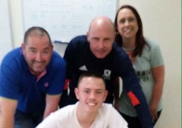 Portadown's Callum Ferris signs his contract with Middlesbrough.
