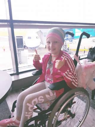 Elsa ready to take the flight to Birmingham to meet the surgeon who will be carrying out the next stage of her treatment.