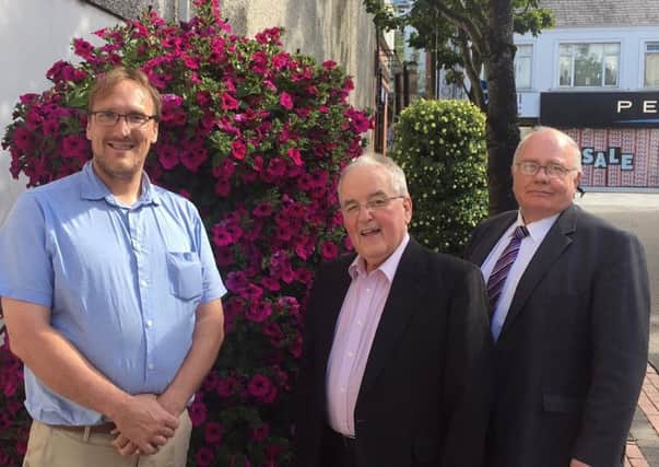 Pictured at one of the beautiful blooming planters in Ballymena town centre is Noel Robinson, Mid and East Antrim Borough Council with PJ McAvoy, Safer Cleaner Accessible Chairman and William Alexander, Ballymena BID director.