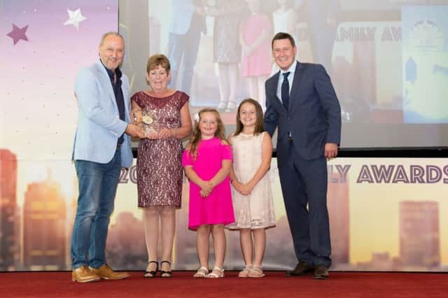 Grandparent of the Year Frances Quinn from Lisburn receives her award from singing sensation Peter Corry.