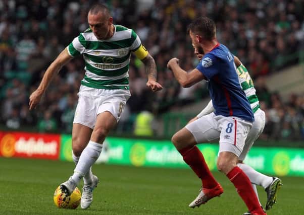 Linfield's Stephen Lowry and Celtic's Scott Brown