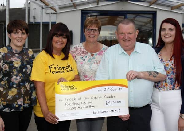 Robert Sewart presents a cheque for Â£4105 to Claire Hogarth the Northern Ireland fund-raising manger for Friends of the Cancer in Belfast at the Royal British Legion clubrooms in Ballymoney. Included are Robert's wife, Margaret, and daughters, Stacey (left) and Abbie.