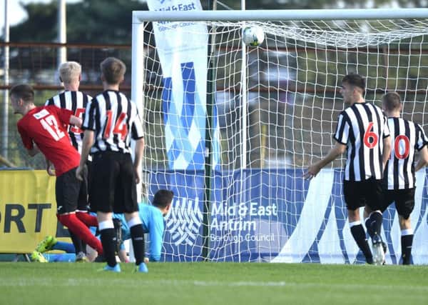Co Antrim and Newcastle United at Ballymena showgrounds.
Co Antrims Aaron Donnelly fires his team into a 2-0 lead