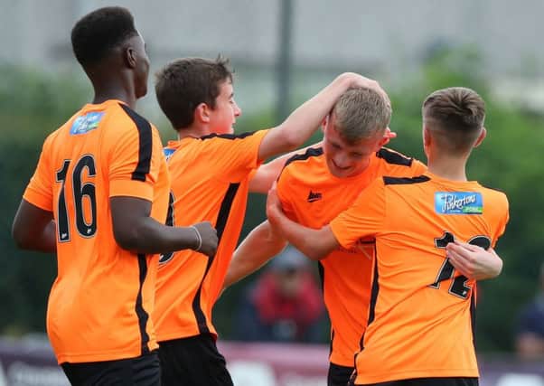 Celebration time for County Armagh's Junior players at the SuperCupNI. Pic by PressEye Ltd.