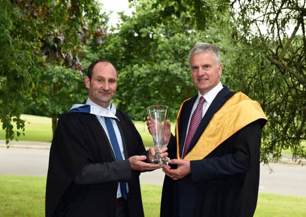 Brian O Neill, Process Technician, with Kerry , Coleraine  receiving The Encirc Award from Mr Derek McDowell Head of Food Technology Education at Loughry Campus.