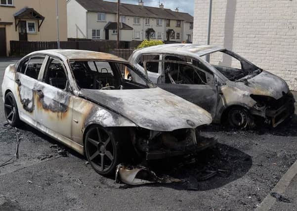 The burnt out cars in Garvaghy Park.