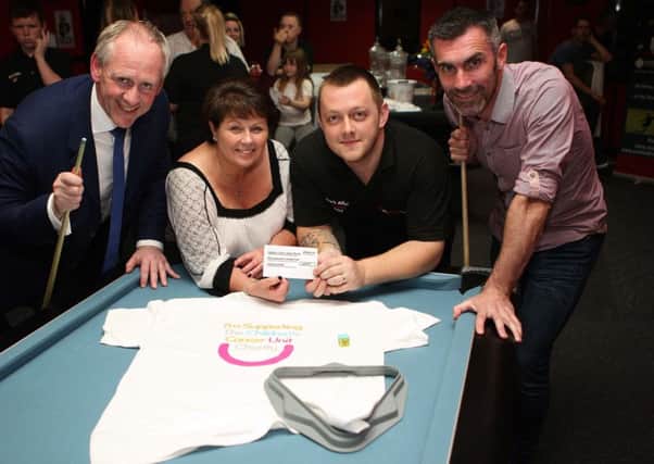 Jacqueline Wilkinson accepted a cheque on behalf of the Children's Cancer Unit Charity following a three day snooker tournament at the 147 Snooker Club in Antrim. She is pictured here with (L-R) Paul McLean, McLean Bookmakers, Mark Allen, who organised the event, and Keith Gillepsie who took part.