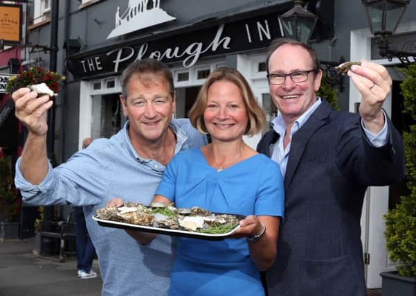 Derek Patterson, owner of The Plough Inn, Sarah Waugh, Hillsborough International Oyster Festival Committee, and Philip Orr, Chief Executive, UPU Industries, announce the upcoming UPU Plough Fest. Pic by Darren Kidd , Press Eye.