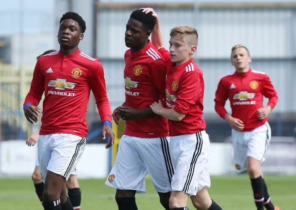 Manchester United's Ademipo Odubeko celebrates with team-mates after scoring  against  County Armagh in the SuperCupNI Globe semi-final. Pic by PressEye Ltd.
