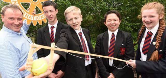 Pictured with the winning design are; Year ten pupils at Ballymena Academy James Cahoon, Adam Thompson, Jacob Natalicio and  Amy Harte along with Seamus Walsh, of Dungannon Rotary Club.