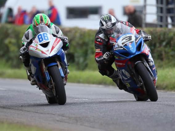 Michael Dunlop (3) and Derek McGee (86) in the Open Superbike race at Armoy on Saturday.