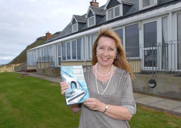 Jennifer Riley of Ballygally Holiday Apartments with an Excellence in Tourism Award. Archive pic. INLT 44-363-PR