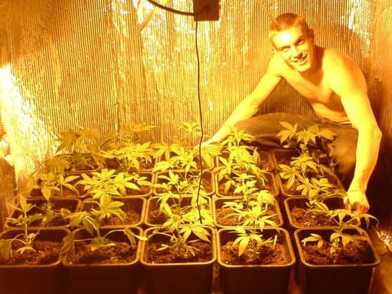 Former Royal Marine Ciaran Maxwell posing with cannabis, in an image recovered from one of his memory cards.