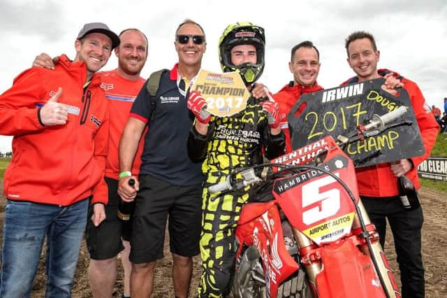 2017 British MX1 Champion Graeme Irwin celebrates with Buildbase Honda team mates.