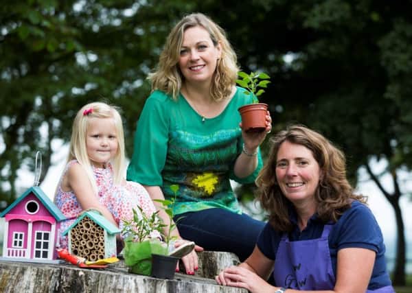 Event organiser Joanne McErlain (centre) joins four-year-old Teegan Coates from Lisburn and gardener Jilly Dougan to launch the third Speciality Food Fair in Moira.