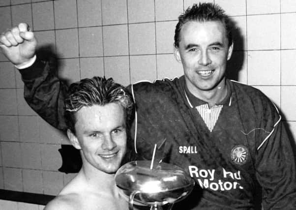 Gregg Davidson (left) and Stevie Cowan  celebrating during Portadown's run of silverware across the early 1990s. Both players will be back at Shamrock Park this week for a special exhibition game.