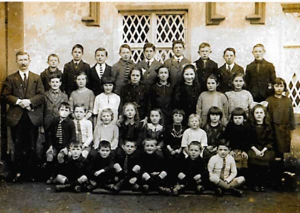 Florence, second row from bottom, third from left, with fellow pupils and her father, Master James Anderson.