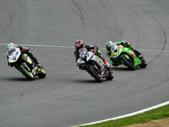 Keith Farmer (33), race winner Jack Kennedy (4) and Andrew Irwin (8) battled it out all the way to the finish at Brands Hatch.