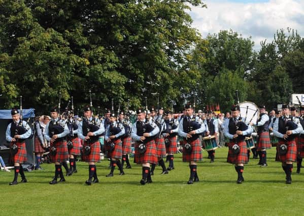 Pipe Major Richard Parkes MBE (left in front row) and Field Marshal Montgomery Pipe Band pictured entering the competition arena at the Lisburn & Castlereagh City Pipe Band Championships at Moira on Saturday 5th August.