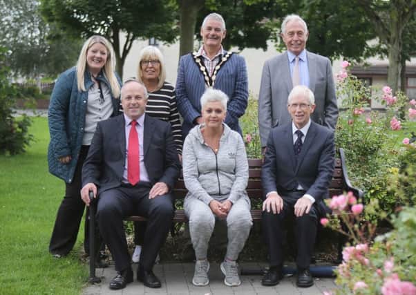 Pride of Place judges Mr William Beattie and Mr Donal Connolly with members of Seymour Hill & Conway Residents' Group committee; Mayor Tim Morrow; Alderman James Tinsley, Chairman of the council's Leisure & Community Development Committee, and Rhonda Frew, Community Support Officer.