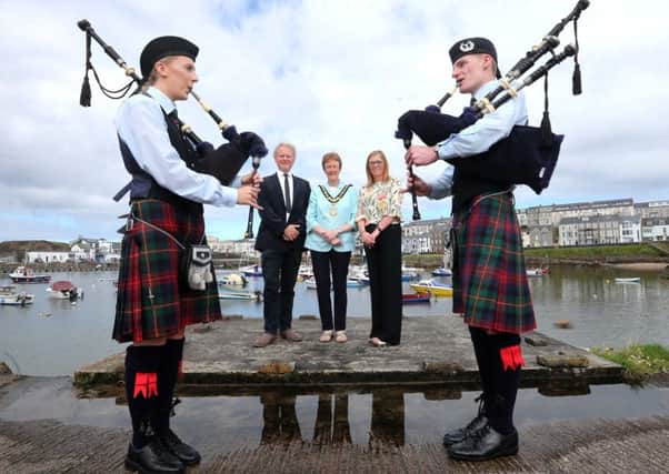 Mayor of Causeway Coast Joan Baird OBE, with operations manager Annette Deighan and Murray Bell, vice-president of Causeway Chamber of Commerce, along with pipers Sarah Jane and Robbie Bellingham of the Ballydonaghy Pipe Band