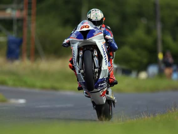 Peter Hickman set a new outright lap record of 134.210mph on his way to victory in the Dundrod 150 Superbike race.