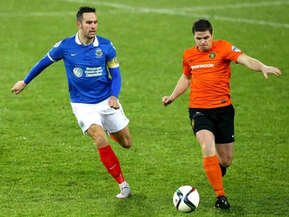 Ben Roy (right), seen here in action against Linfield during his first spell for Carrick